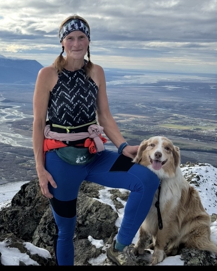 Gail Taylor and dogs on top of a mountain